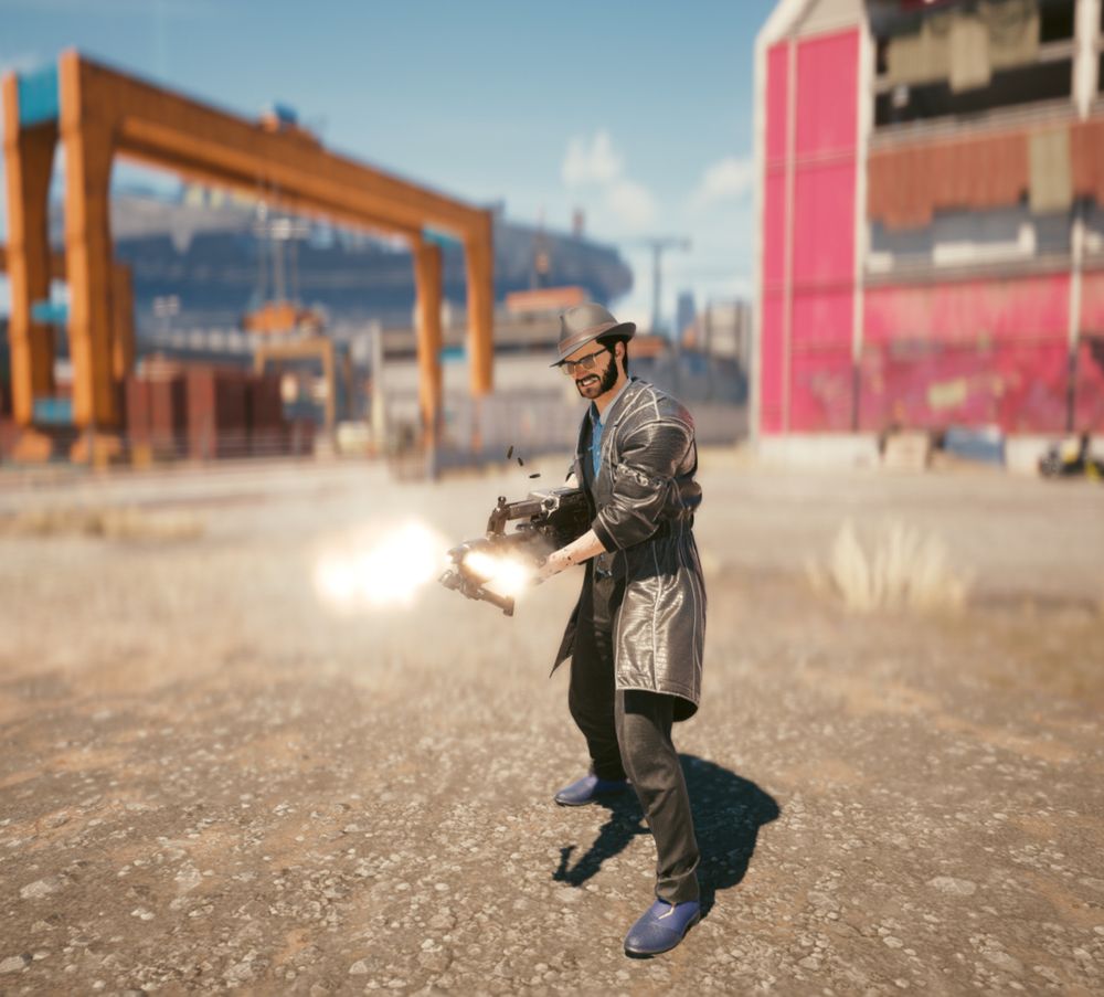 V, from cyberpunk 2077, firing his machine gun while dressed like a 1940s PI. 