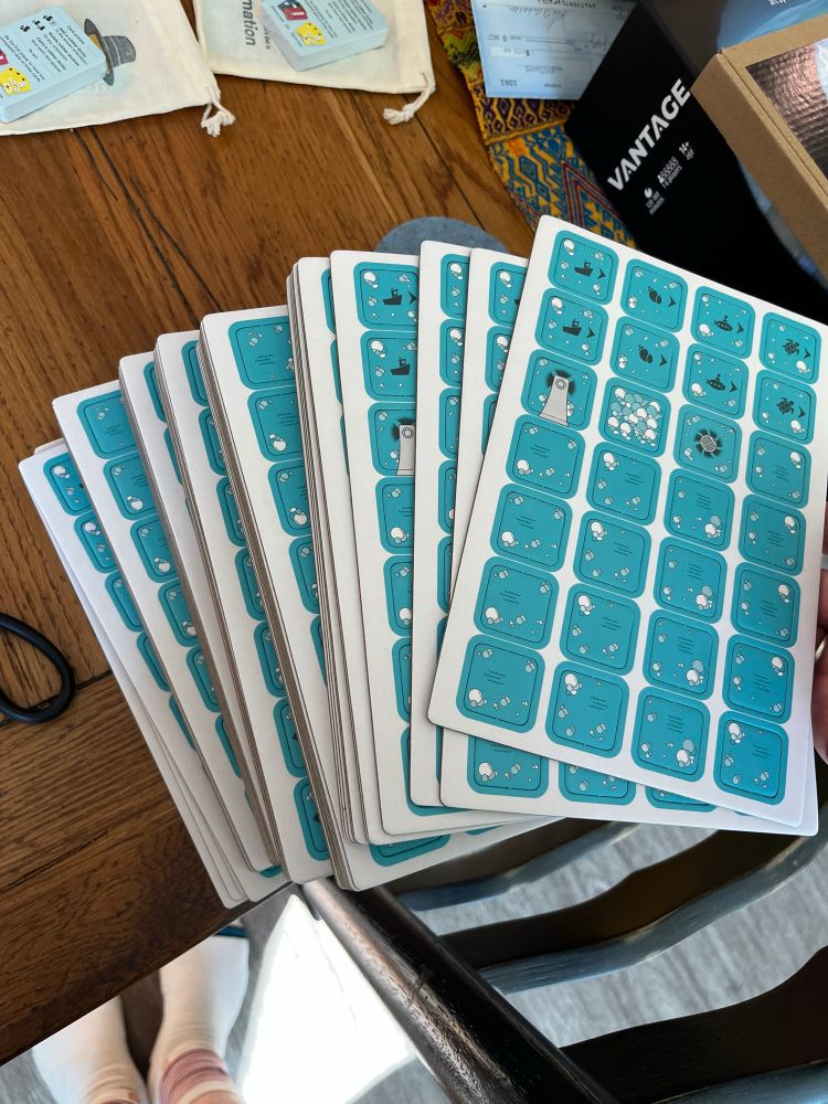 50+ cardboard punch sheets with a grid of bathtub tiles