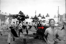 Black and white photograph of people fleeing the 1946 tsunami