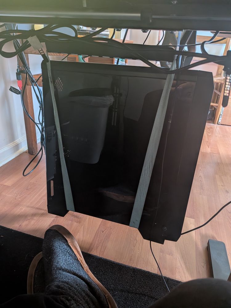 My pc, suspended under my desk by ratchet straps