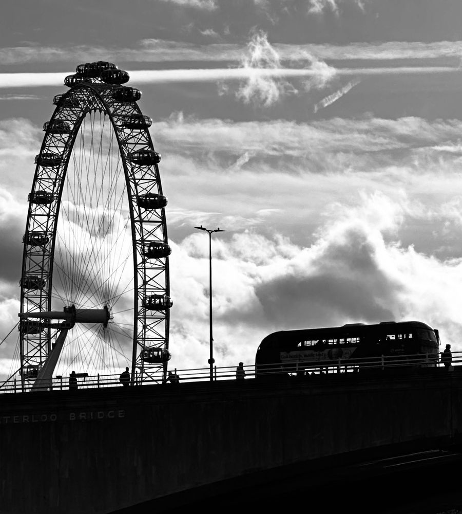 Silhouette of London Eye and a London bus.