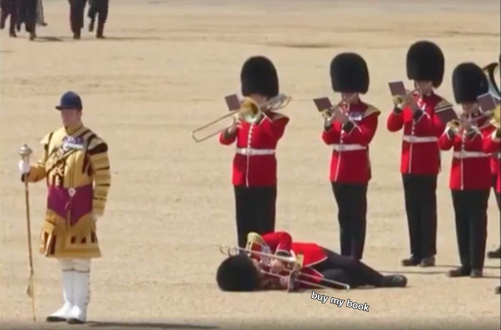 screenshot of british soldiers in full uniform playing brass instruments in a band on a summer day. one trombonist has keeled over from the heat but still clutches the horn to his lips. I have added text to make it appear that he is sadly tooting "buy my book"