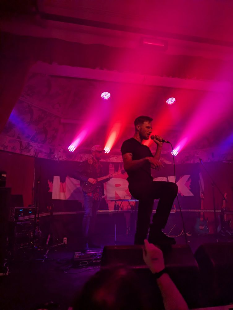 Band on stage with bilights