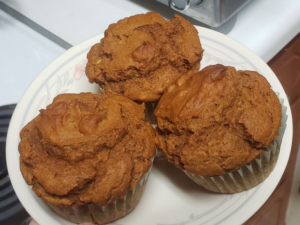 three muffins on a plate