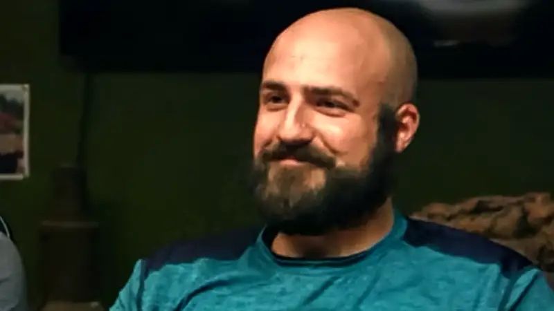 A picture of Jack Begley from Curse of Oak Island with a stupid grin on his face