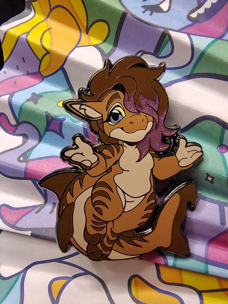 a 2 inch high enamel pin of me, Teabree.