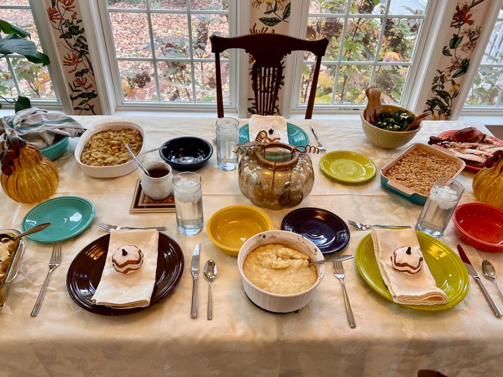 Picture of a dining room table set for Thanksgiving.