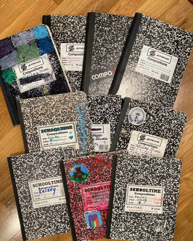 Collection of black and white composition notebooks.