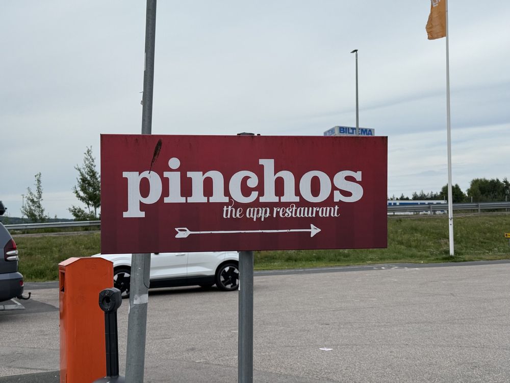 A sign saying: “Pinchos - the app restaurant”