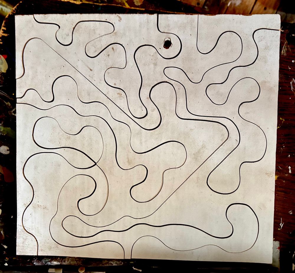 here, a somewhat larger piece (unpainted, with white gesso base) cut into more exuberantly twisty shapes. in this state it is a bit disorienting to follow the shapes.