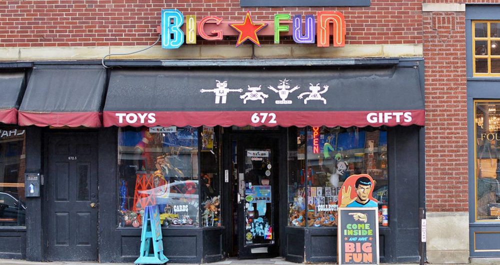 Street side photo of Big Fun Toy Store in Columbus. It’s a brick building with a colorful logo reading “Big Fun” above the store entrance. Spock is there too.