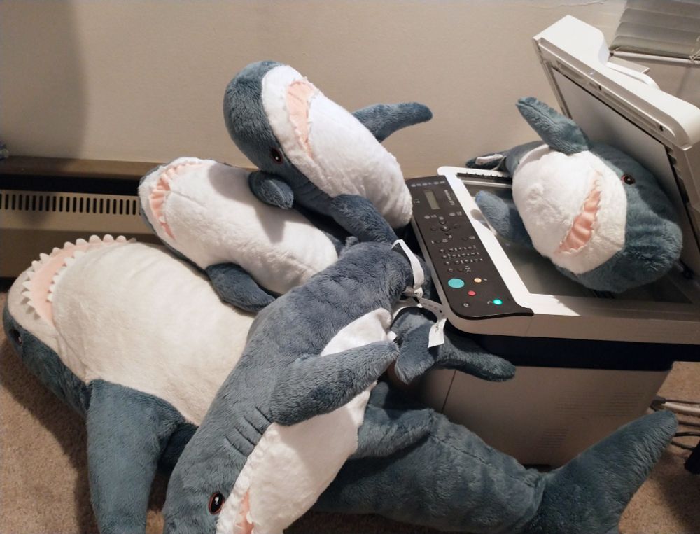 A copier spawning three blahaj