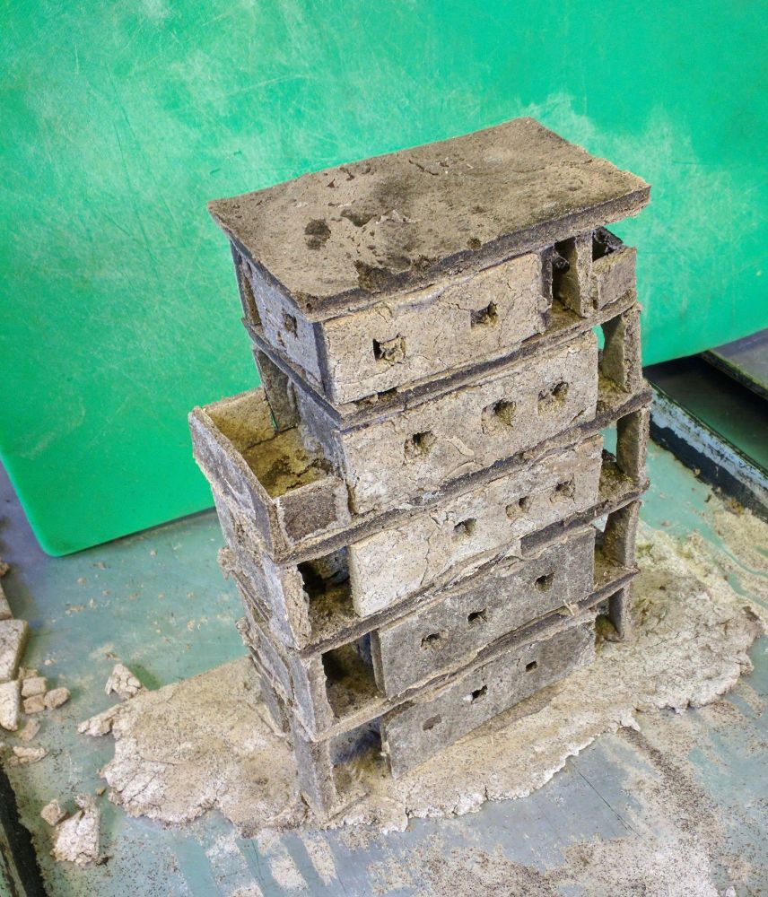 a gingerbread house that looks like it's made out of concrete, and it's a brutalist style highrise