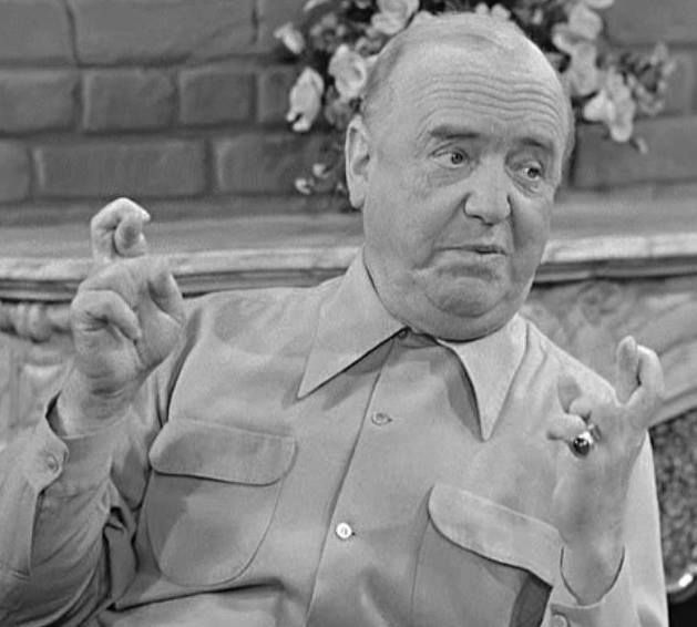 A still of Fred Mertz, from I LOVE LUCY, crossing fingers on both hands