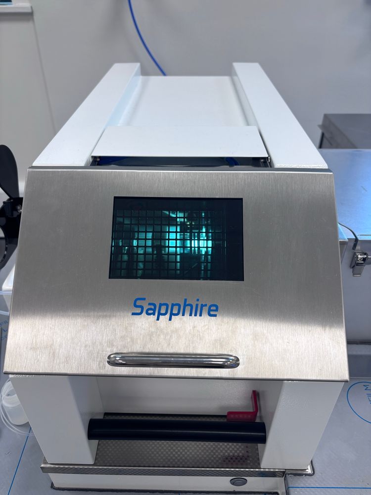 Lit plasma on a Sapphire mass spectrometer glimpsed through the torch box window. 