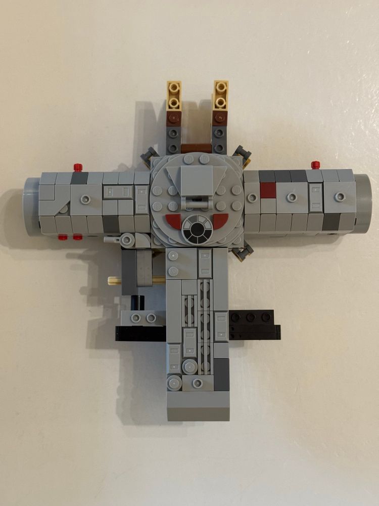 Lego Millennium Falcon parts that look like a T.