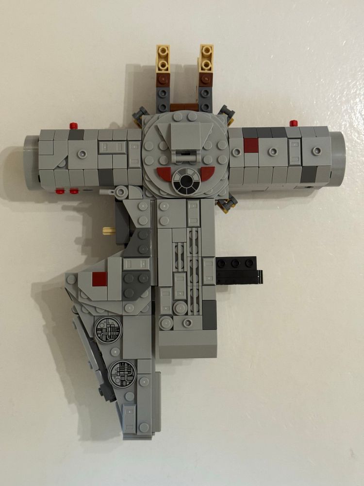Lego Millennium Falcon parts that look like a T with one mandible.
