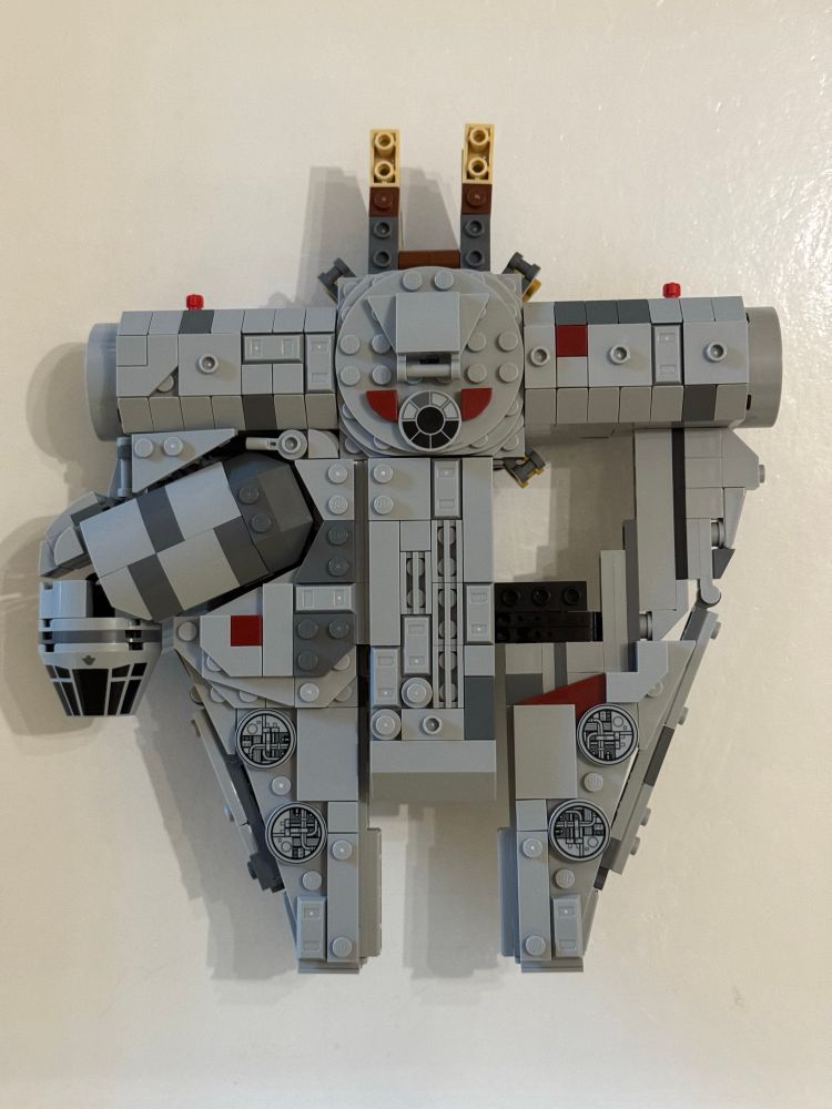 Lego Millennium Falcon parts that look like a T with both mandibles and a cockpit.