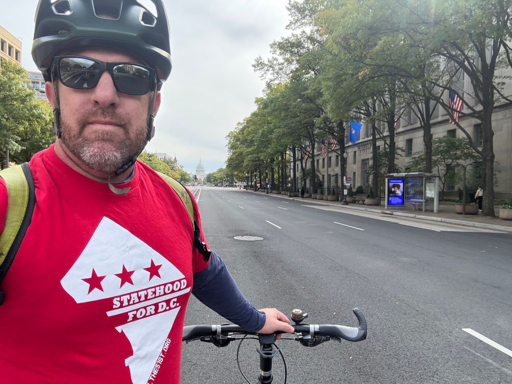 Man with DC statehood shirt on Penn Ave in DC