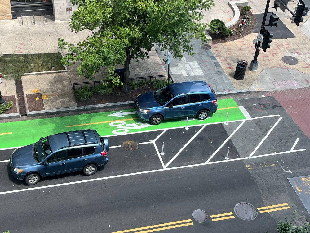 Car parked in bike lane.