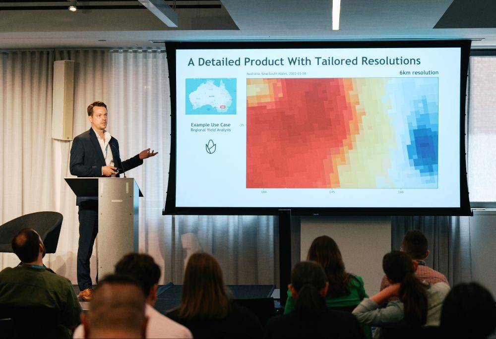 A photo of Dennis Quick, Spire Earth Insights Sales Manager, speaking at the EO Summit. He spoke about the real-world applications of our global, near-real-time soil moisture product and its impact on agriculture, weather forecasting, and risk and security modeling.
