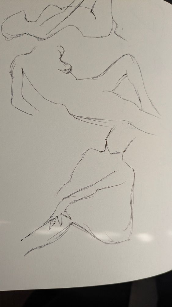 Pen sketches of various feminine figures in different poses.