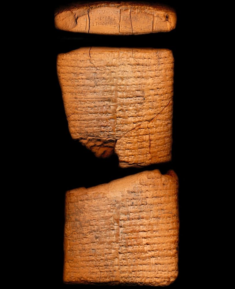 Photo of a cuneiform tablet broken in the middle from the back and top