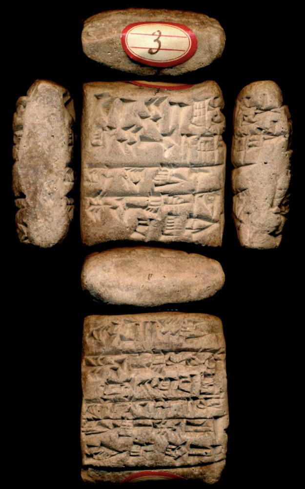 Photo of a square shaped clay tablet covered in cuneiform signs. The images shows the front, back, and sides of the tablet