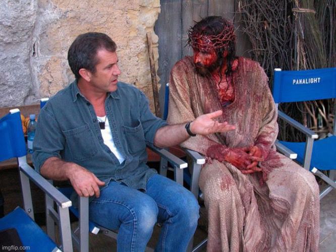 Mel Gibson discusses important things with a bloodied Jim Caviziel
