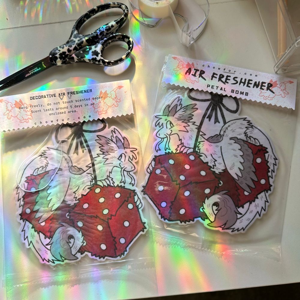 a picture of two air fresheners, a dragon ontop of fuzzy dice. Artwork by Chowfur. do not repost. 