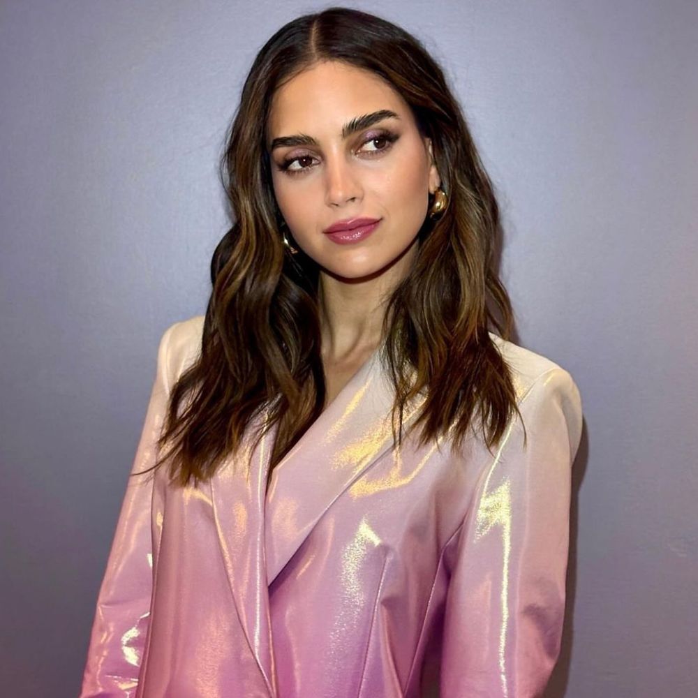 Actress, singer, activist Melissa Barrera looking stunning and radiant in a pink shimmery jacket. 
