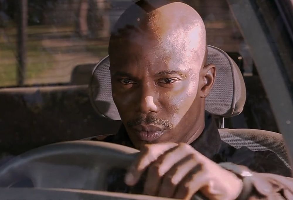 Doakes from Dexter looking suspiciously from a car