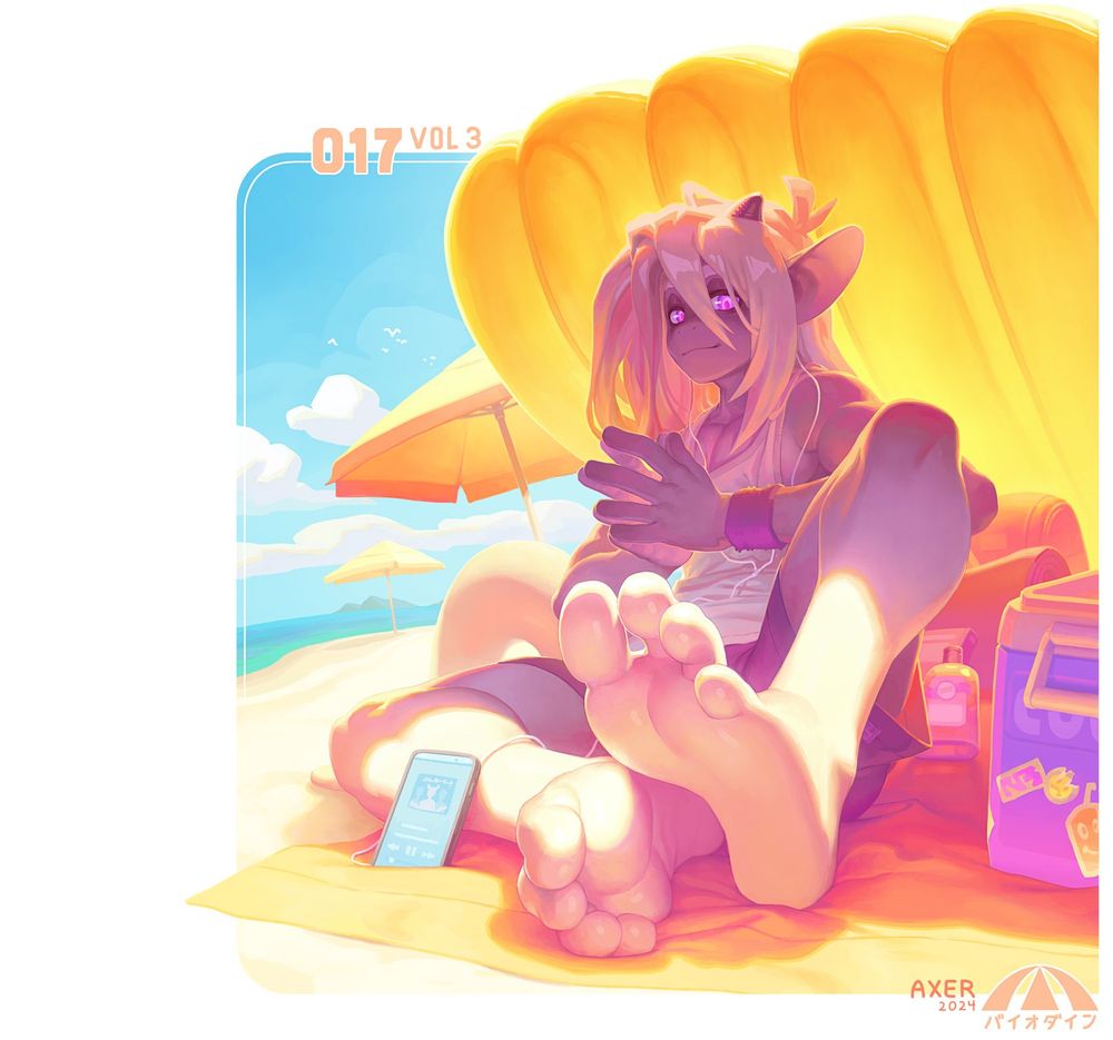 axer sits under an inflatable pool raft in the summer sun on the beach. he is listening to music while his legs and feet are in the sun
