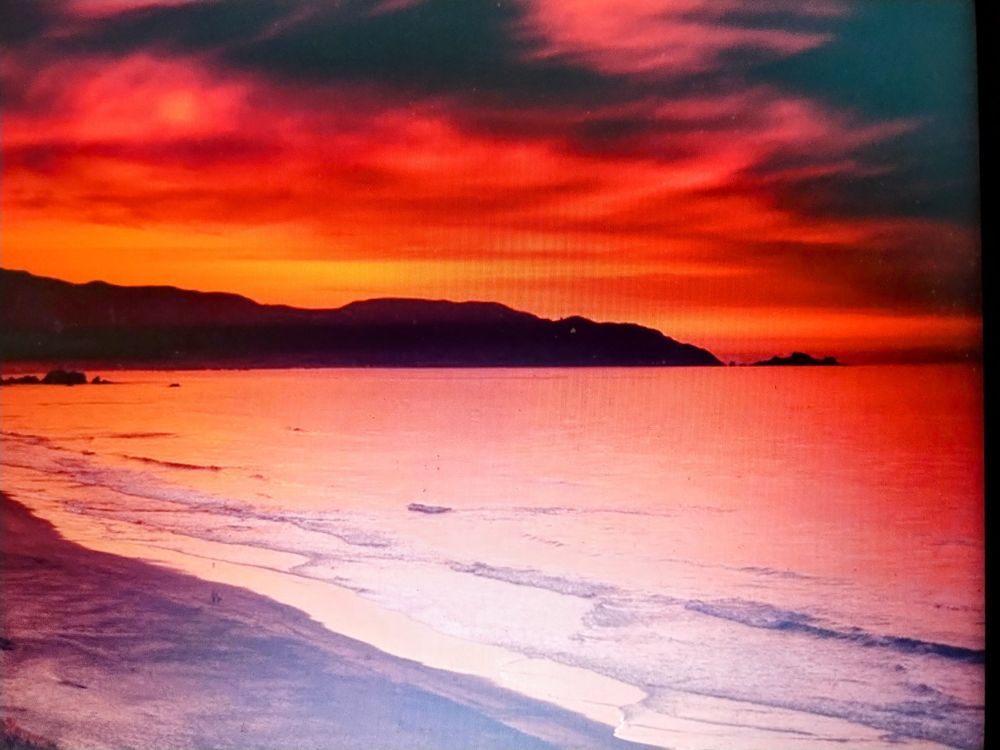 A very dramatic sunset on a shoreline far far away, looking a bit like Mars before the Martians left. 