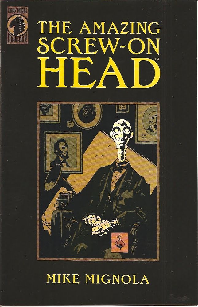 The cover of the Comic Book "The Amazing Screw-On Head, by Mike Mignola" with A Robot in a Black Suit seated in an old-timey photo gallery with a picture of Abraham Lincoln.