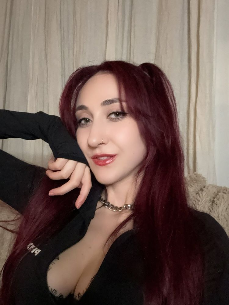 A selfie of a redhead egirl findom. shes staring right through you. Causing you to relapse into sending her everything because thats the only thing that matters