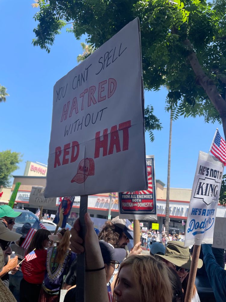 At No Kings in Studio City, CA this sign reads “you can’t spell hatred without red hat.”
