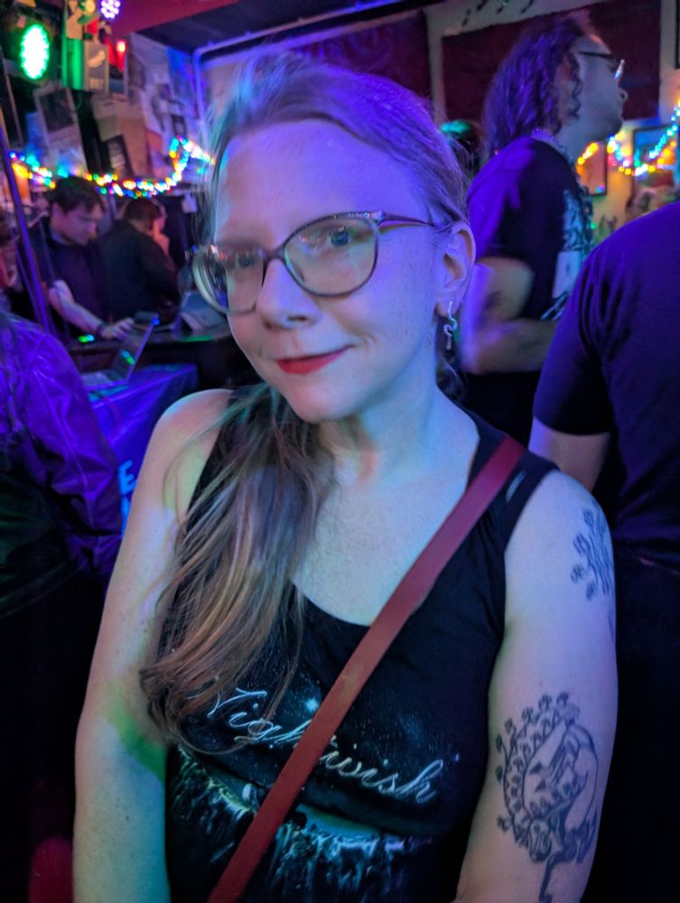 An adorable person with red lipstick in a nightwish tshirt.  I'm sorry this alt text sucks, I'm drunk. 