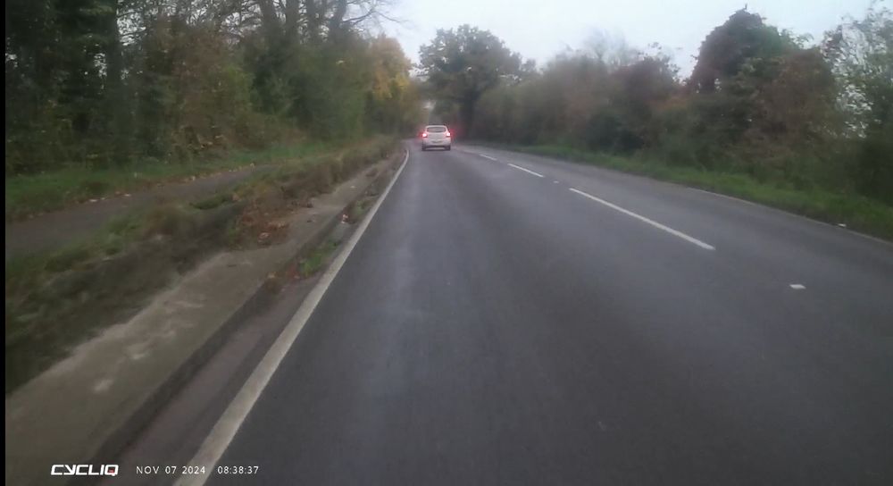 A415 40mph road alongside causeway footpath. 