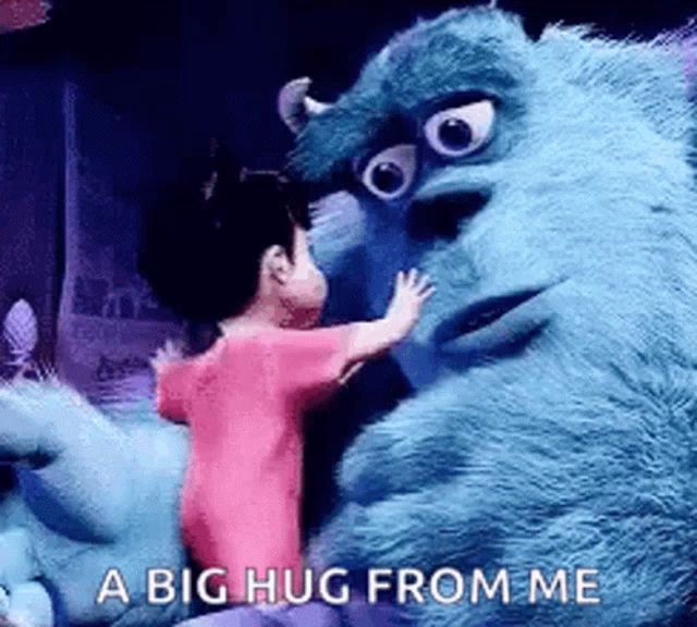 sulley from monsters inc is hugging a little girl from monsters inc .