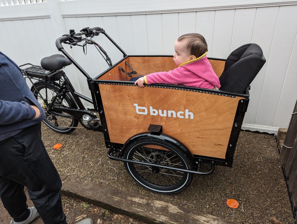 toddler in toddler seat in bunch bike
