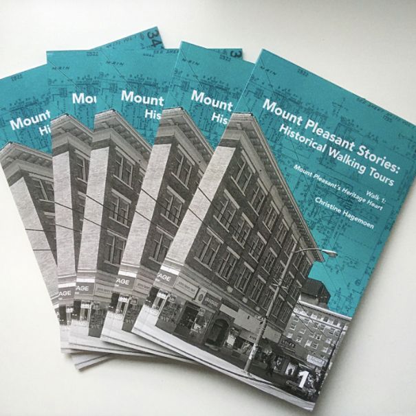 Fanned out stack of Mount Pleasant Stories: Historical Walking Tours Walk 1 Mount Pleasant's Heritage Heart by Christine Hagemoen. The cover features a black & white photo of an older brick buildings and street with a turquoise blue sky with map underlay. 