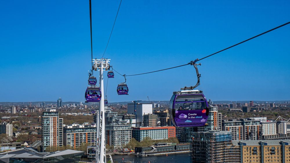 Greenwich UK Day 31. Stretching gracefully over the River Thames, the IFS Cloud Cable Car connects Greenwich Peninsula (near The O2 Arena) with the Royal Docks (close to the ExCeL London exhibition centre). Opened in 2012, this modern urban cable car system offers passengers a unique aerial view of London’s Docklands and skyline.

The cable car is operated by Transport for London (TfL) and is currently sponsored by IFS Cloud, a global enterprise software company. Originally built as the Emirates Air Line in partnership with Emirates Airline, it was the first urban cable car of its kind in the United Kingdom.