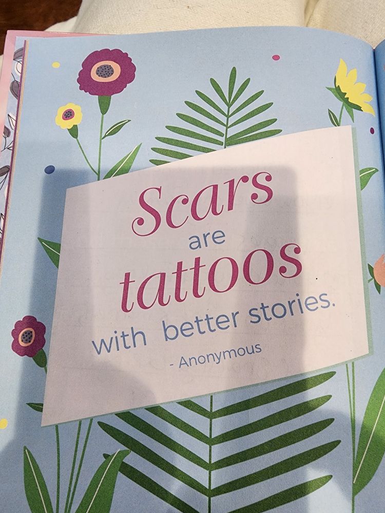 Page from a book that says "Scars are tattoos with better stories. "