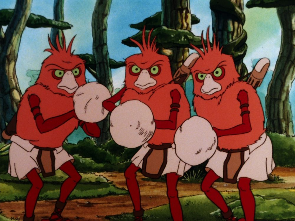 The Fuzzums were a species of sentient avians indigenous to the planet Dandelo. Members of the species were roughly humanoid, standing shorter than the average Human on spindly legs. The arms and legs were hairless and brown-skinned, but the squat body was covered with orange fuzz.