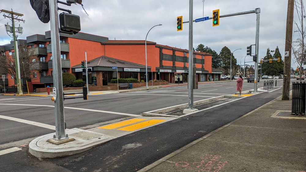 A closer look at the new pedestrian and cycling crossing lights, as well as bike racks at the intersection of Hillside Avenue and Nanaimo Street.