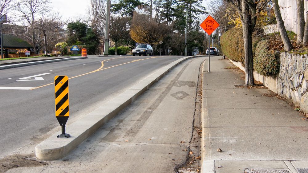 A view of the new concrete curbs for the protected bike lane on Gorge Road. Looking West from the intersection of Gorge Road and Washington Avenue.