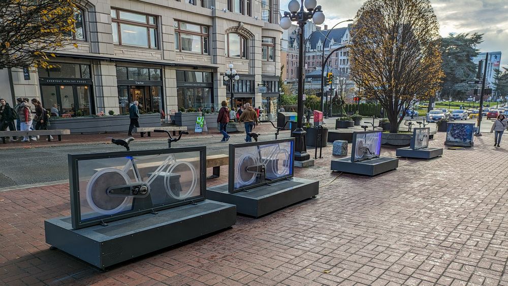 Looking south on Government streets at four bicycles you can ride in an interactive art installation to play music and see projected images.
