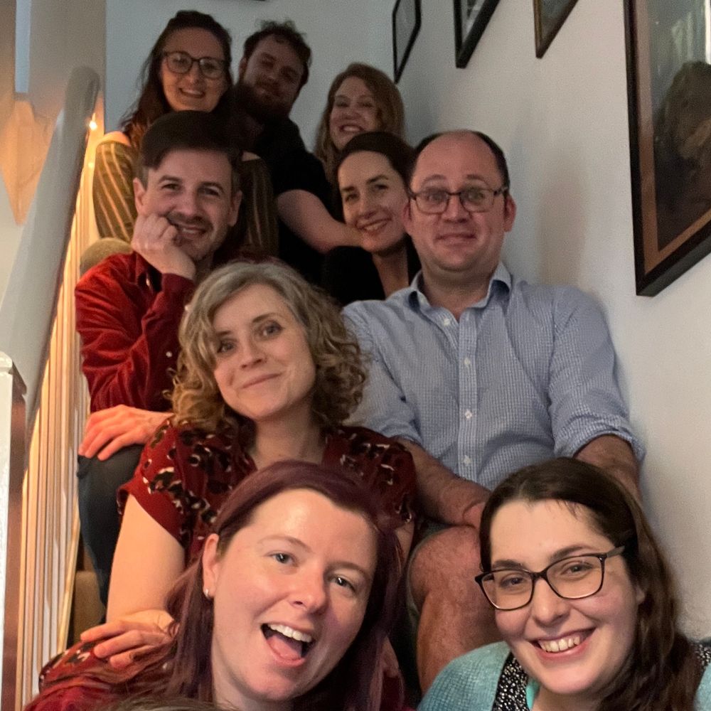The cast and crew from the first day of filming sitting on a staircase. Top to bottom: Hedley Knights, Lowri Ann Davies, Grace Kelly Miller, Nancy White, Nathan Peter Grassi, Max Windich, Jen Sugden, Beth Crane and Adie Hart