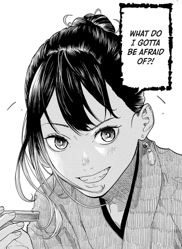 A manga panel from “Akane-Banashi” featuring a closeup of the main character, Akane. She is grinning and her hair is moving as she leans forward. She is holding a fan (barely visible) and saying “What do I gotta be afraid of?!” She appears to be in the middle of a rakugo performance based on the fan and the stylized speech (also indicated by the rough edges of the speech bubble)